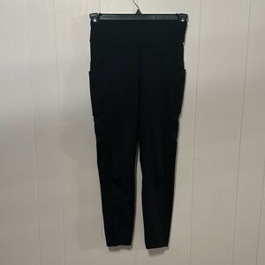 Small black popfit legging with cute mesh side detail under double pockets
